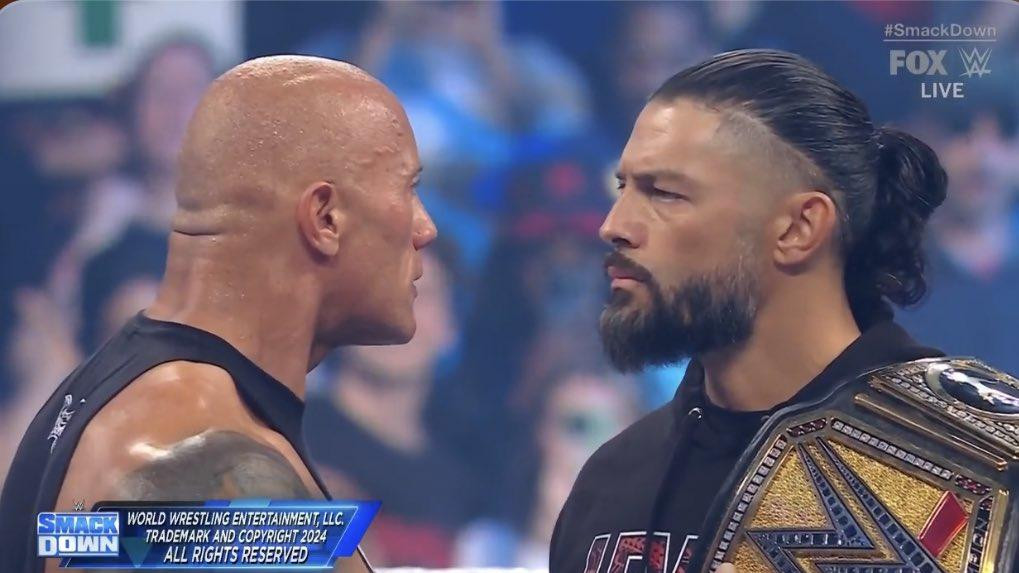 The Rock And Roman Reigns Stand Face To Face To End 2 2 WWE